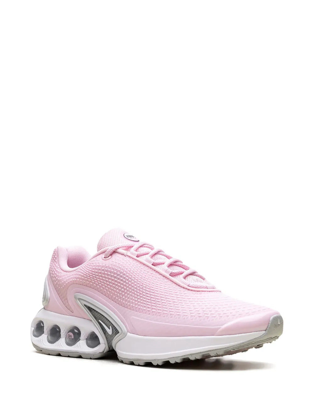 Pink Nike Air Max Dn sneaker, side view with Swoosh logo and lace-up front