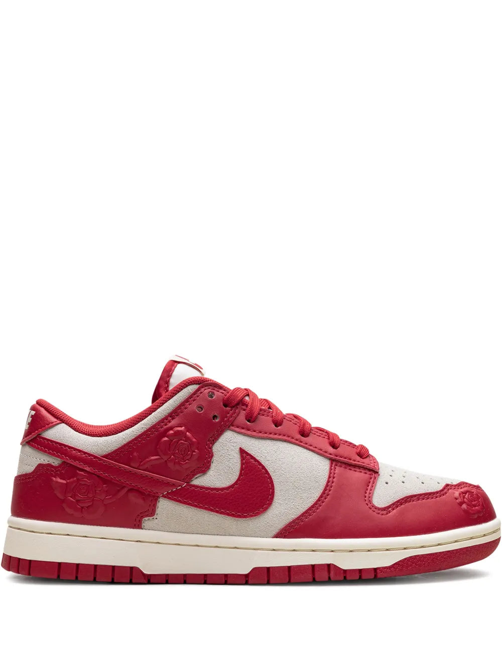 Red and white low-top sneaker with Nike swoosh, lace-up, cream sole.