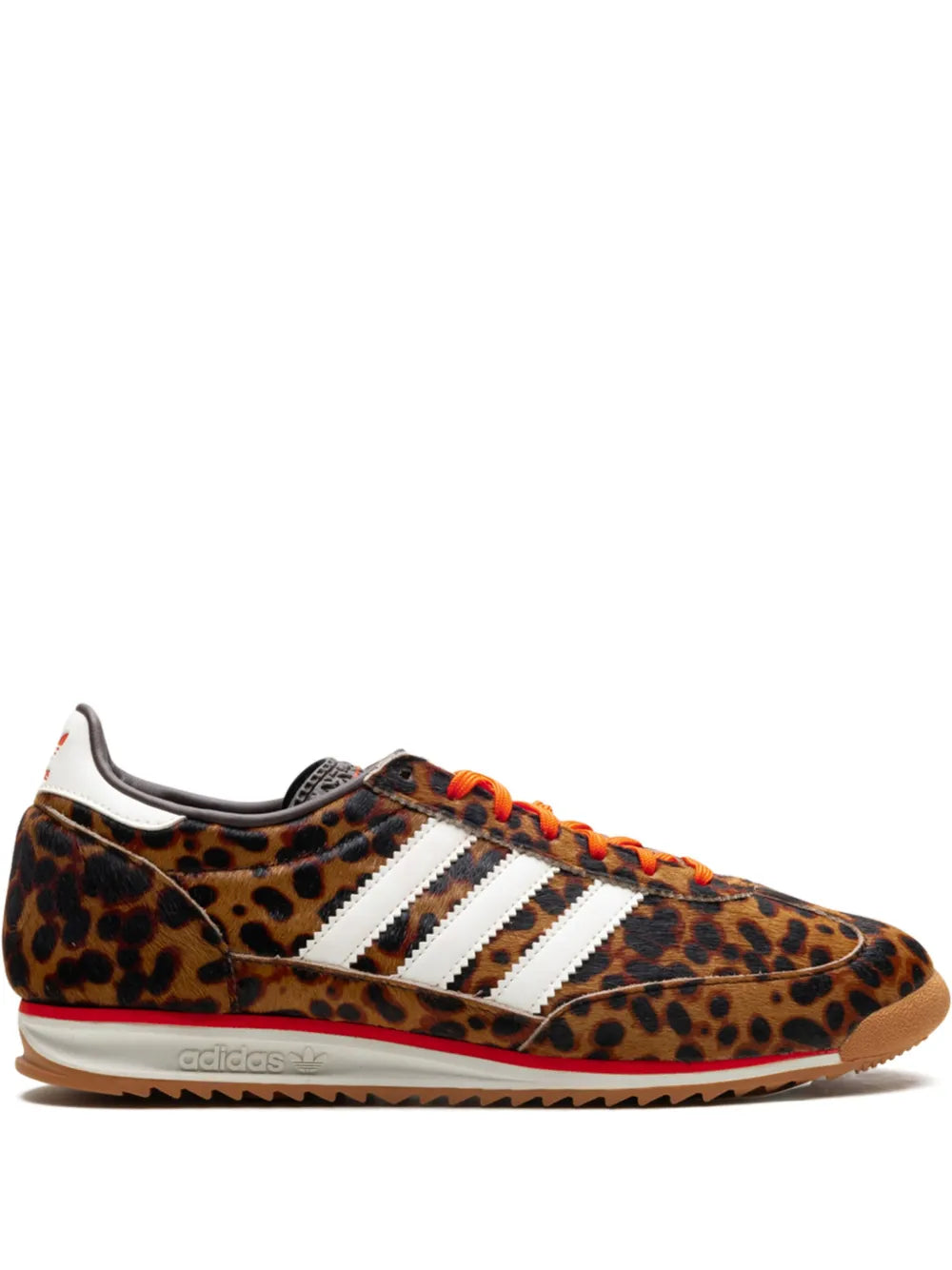 Leopard-print low-top sneakers with white adidas stripes and orange laces