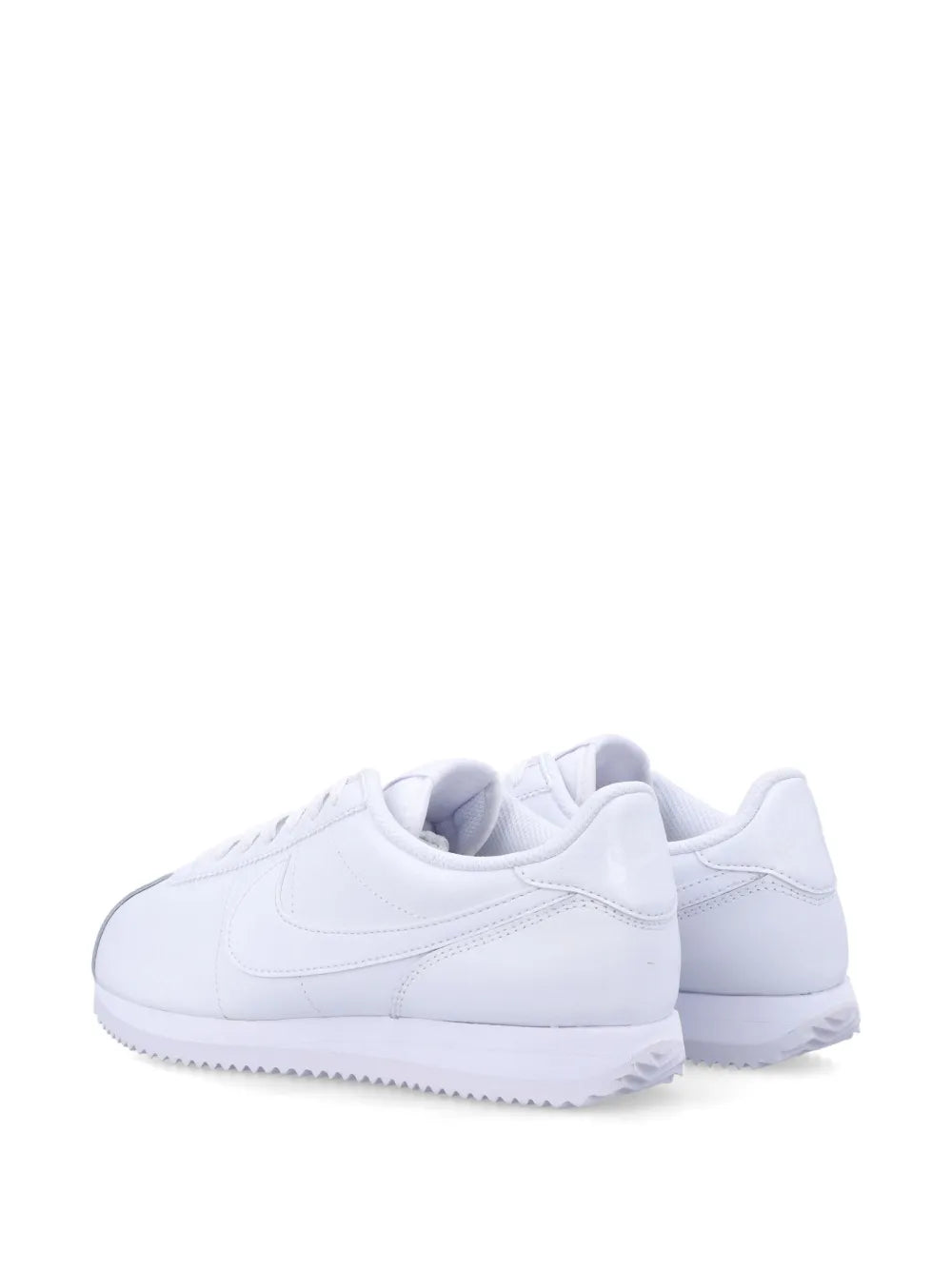 White low-top sneakers with cushioned heel and rubber outsole
