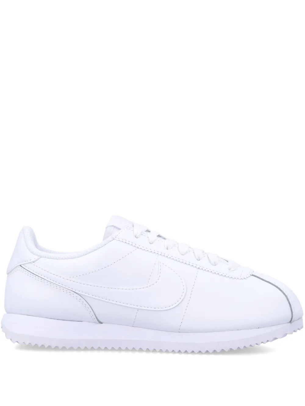 White Nike Cortez low-top sneakers with lace-up closure and side swoosh