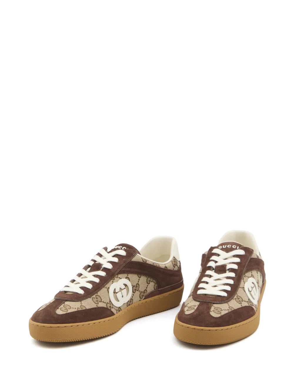 Gucci Interlocking G sneakers pair with GG canvas uppers, white laces, and gum sole