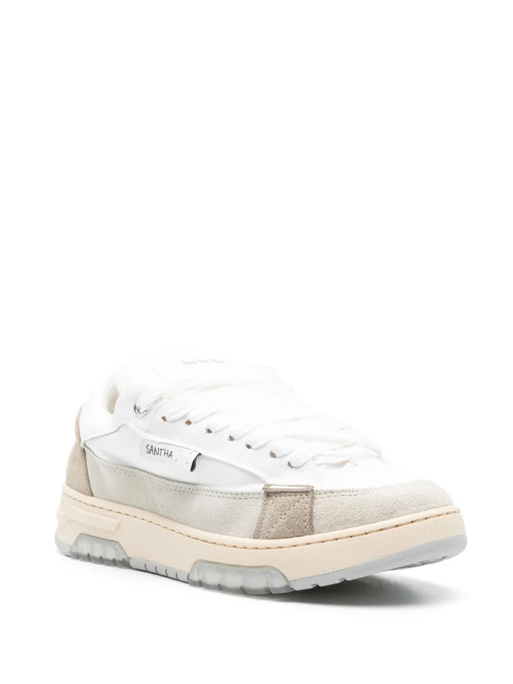 White lace-up sneakers with gray side panels and rugged, chunky sole