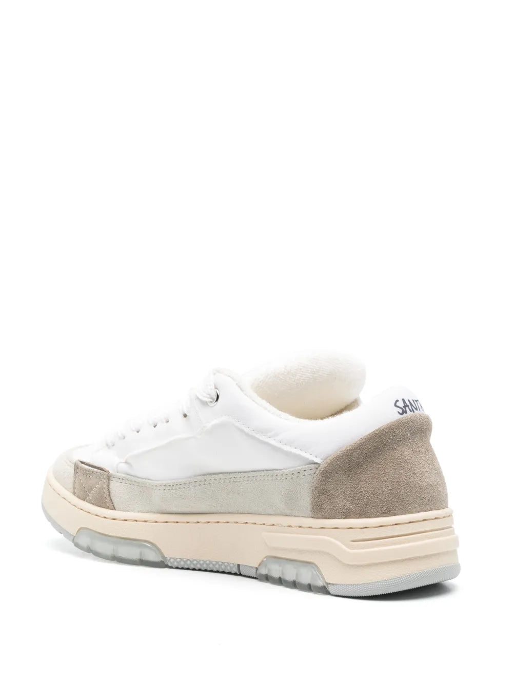 White and gray sneakers with lace-up front, padded collar, and chunky sole