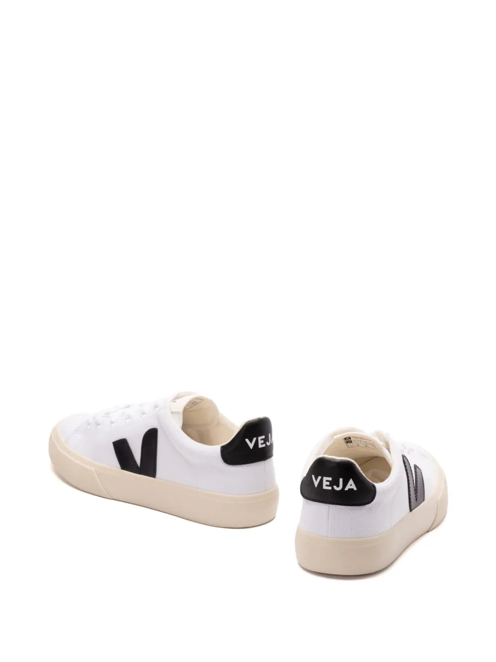 White sneakers with black heel logo patch and beige sole, back view