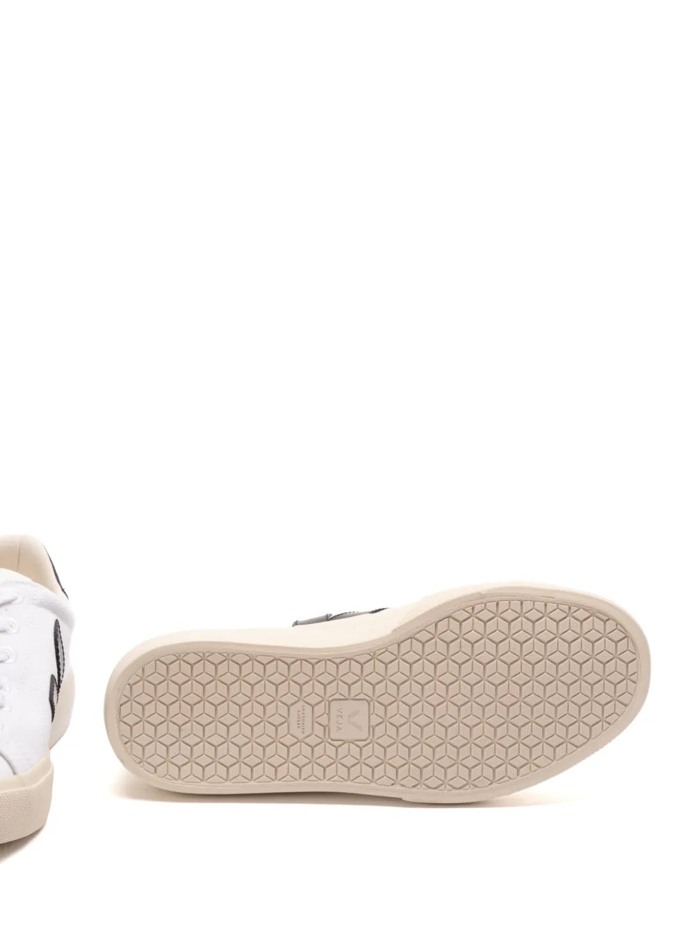 White sneaker outsole with hex-pattern tread and beige rubber sole