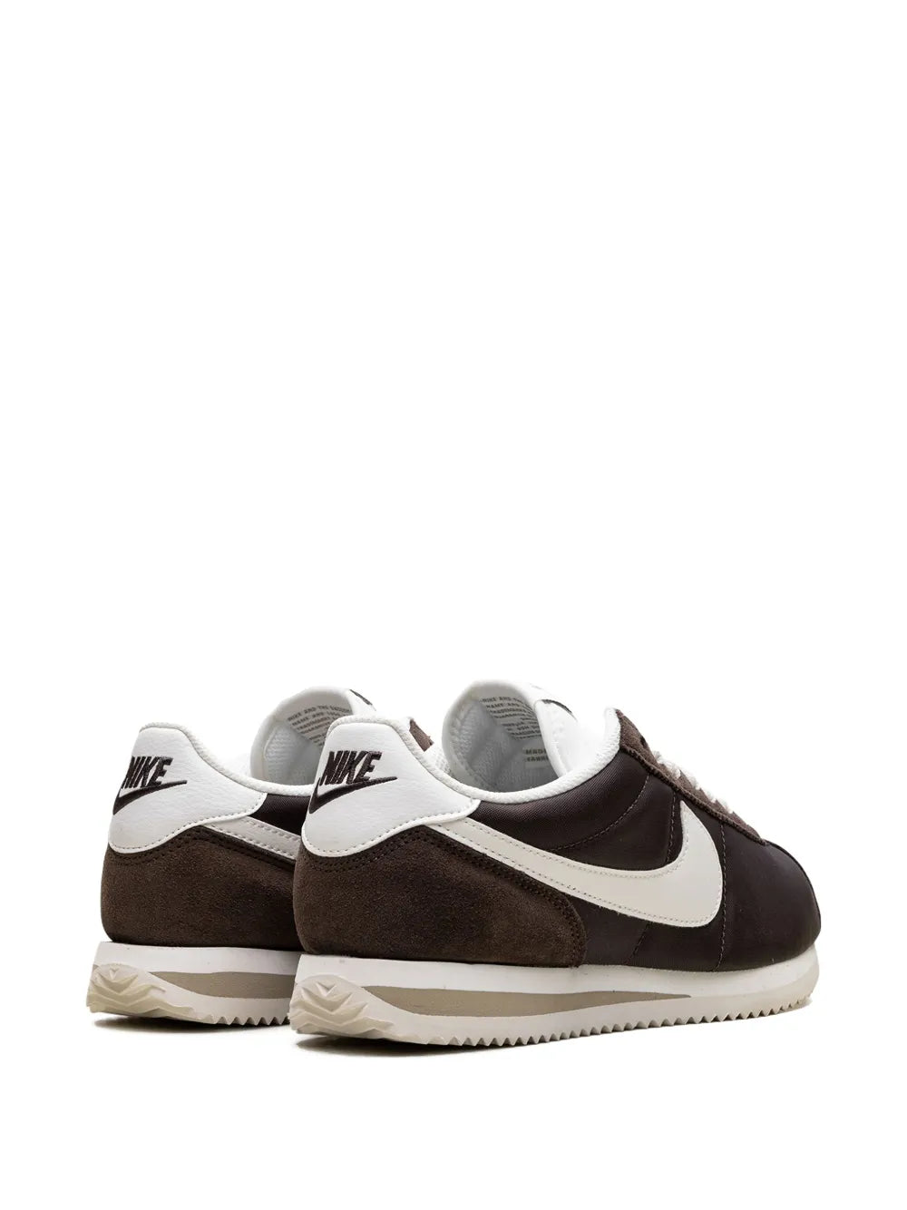 Brown and white sneakers with heel tab logo and cushioned collar