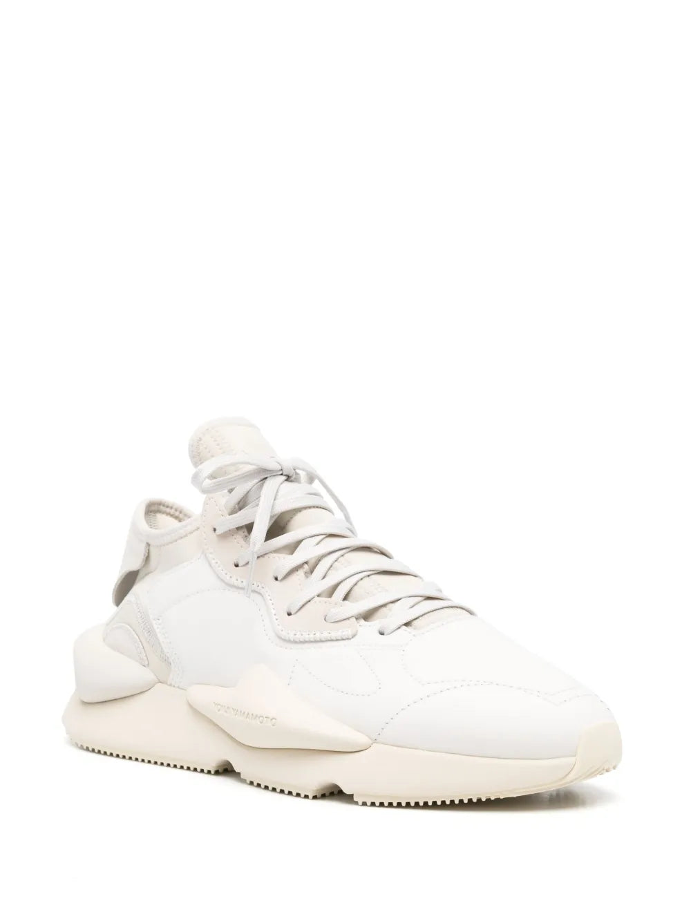 White lace-up low-top sneakers, side view with padded collar and chunky sole