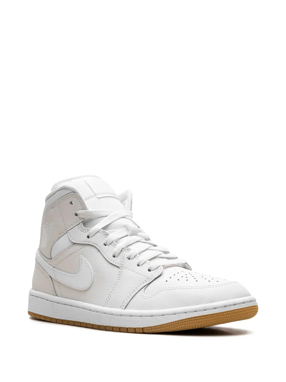 Light brown and white mid-top sneakers, side profile with lace-up and swoosh
