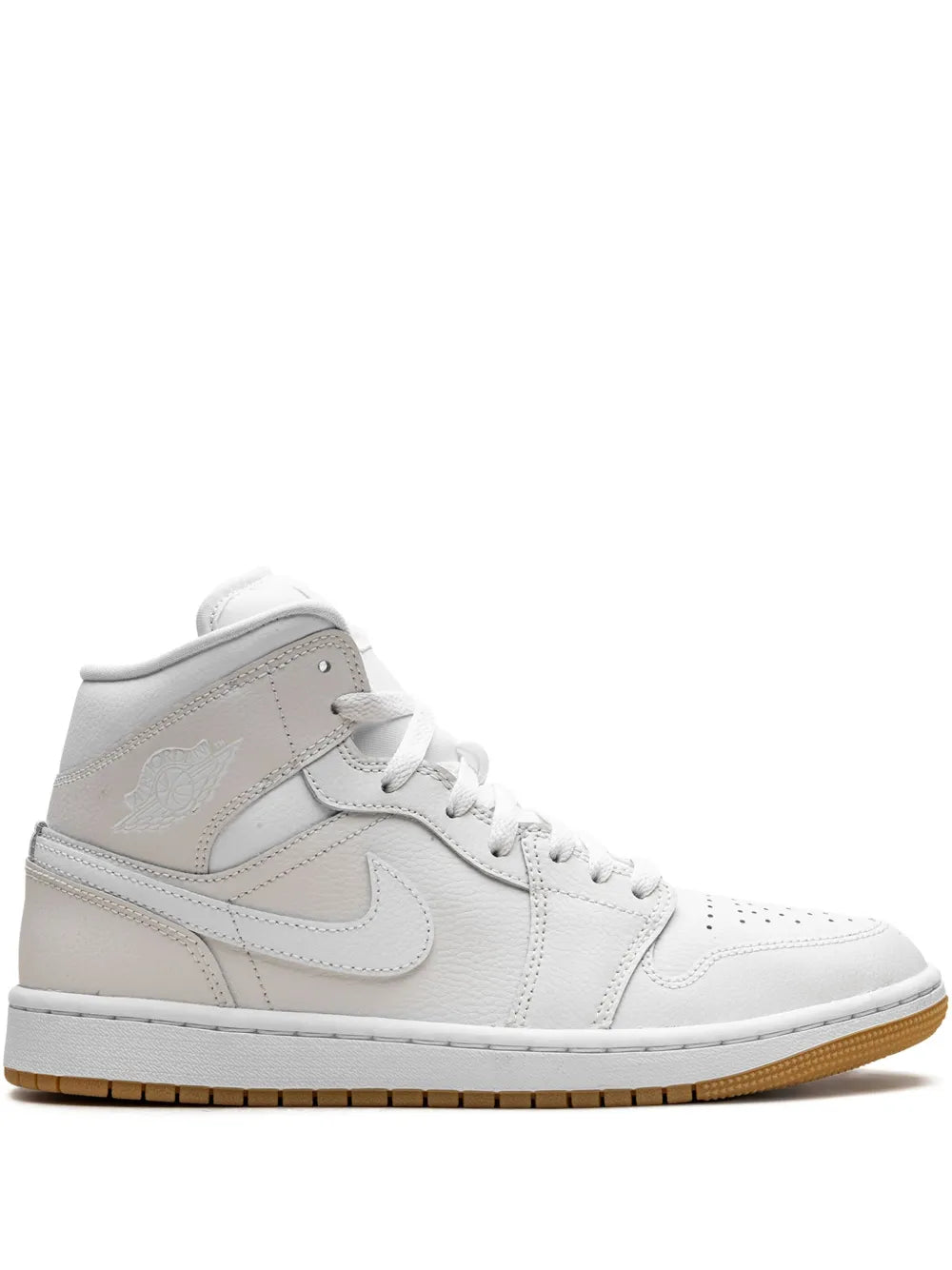Light brown and white mid-top sneakers with lace-up closure and Nike swoosh