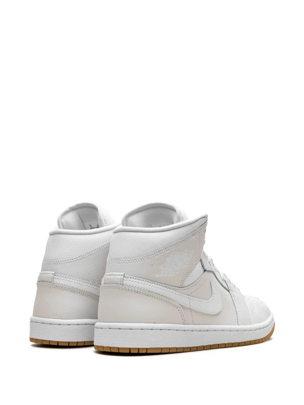 Light brown and white mid-top sneakers, back view with padded heel and swoosh