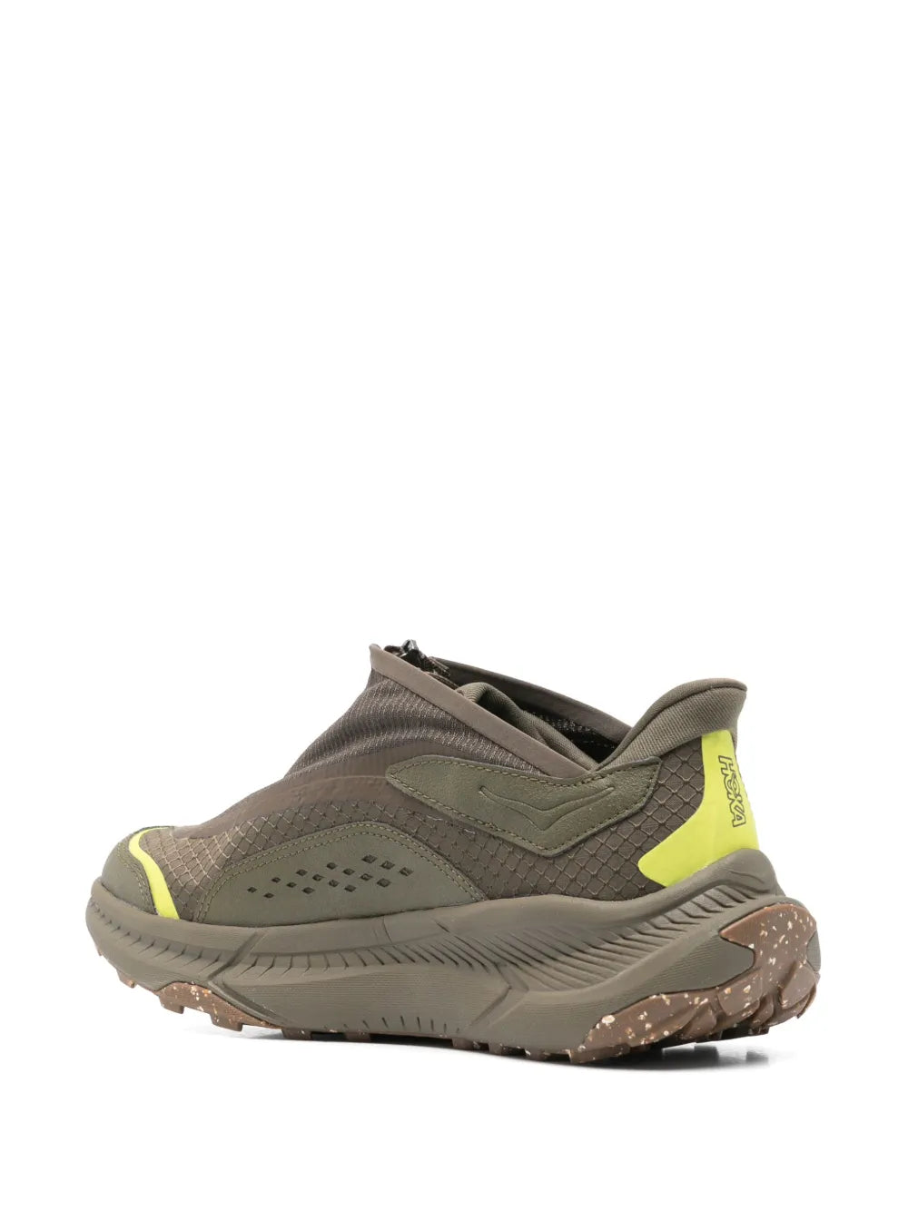 Khaki low-profile sneaker with neon yellow side panel and rugged tread sole