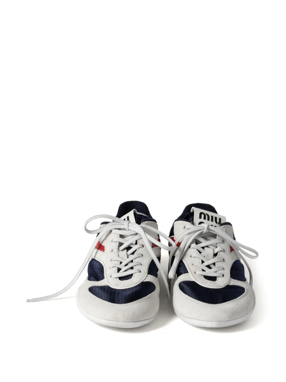Miu Miu lace-up sneakers with white laces, navy uppers, and red accent