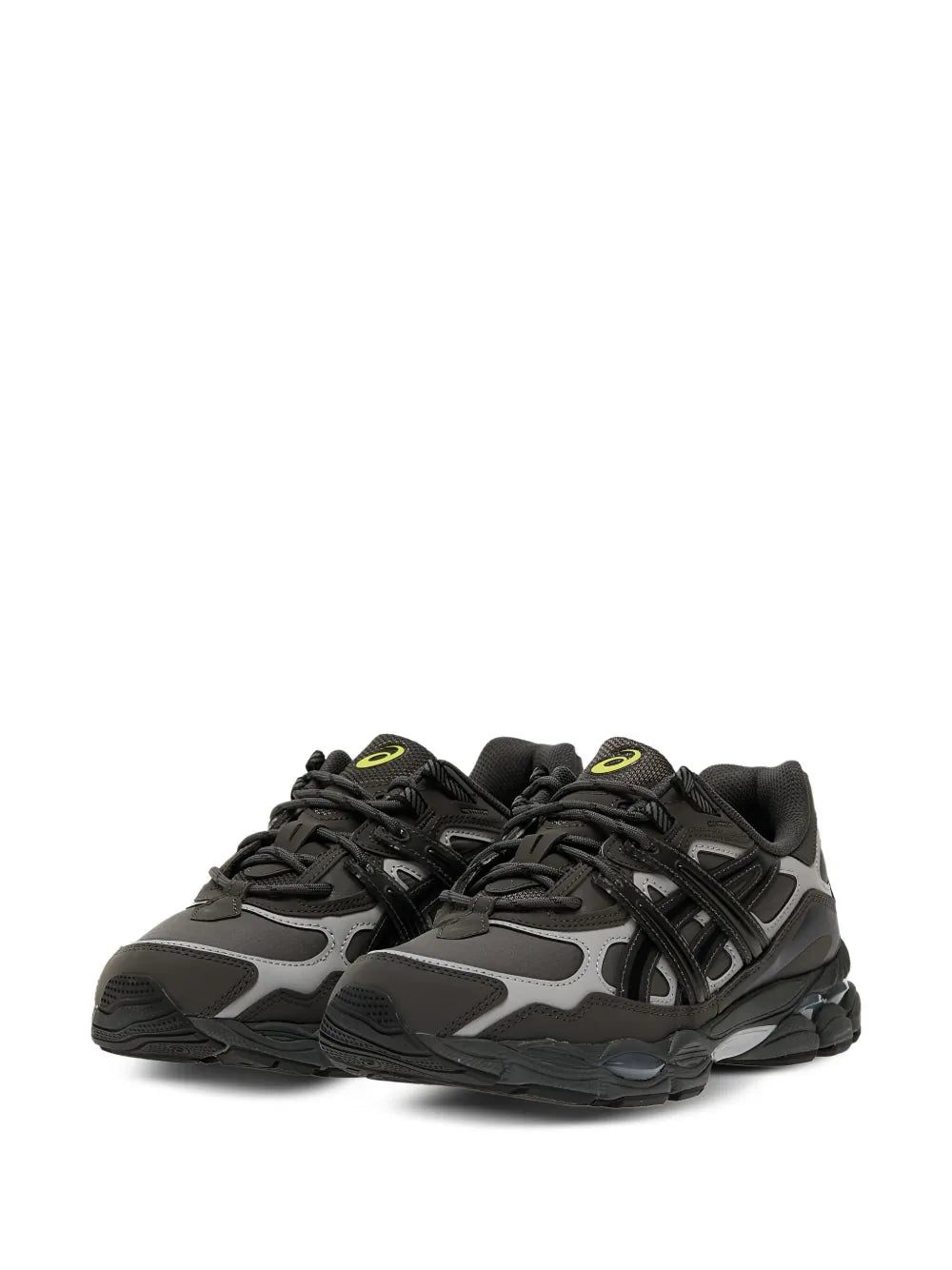 Black and gray sneakers with neon yellow eyelets and thick rubber outsole, side view