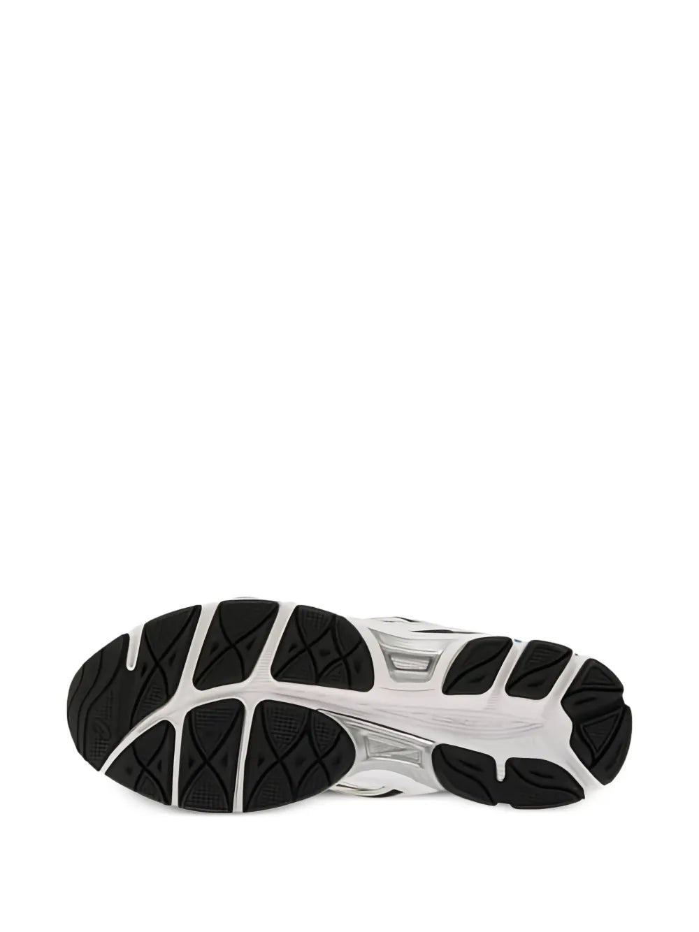 White sneaker outsole with textured rubber tread and black heel cushioning detail