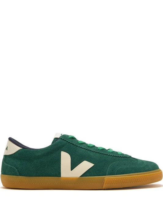 Green low-top sneaker with white V logo and gum rubber sole