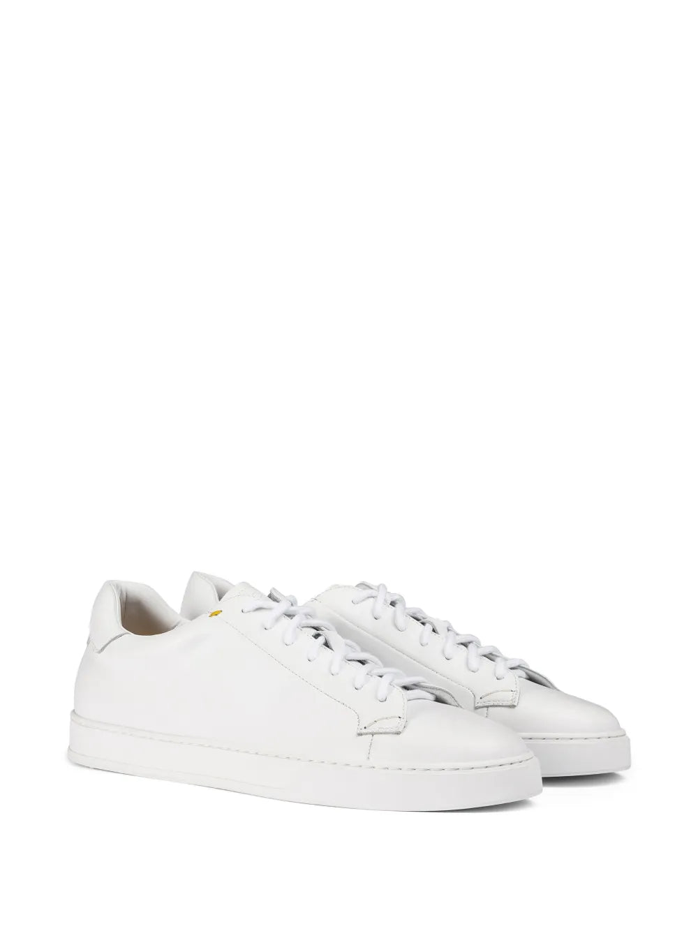 White leather low-top sneakers, pair view with lace-up closure