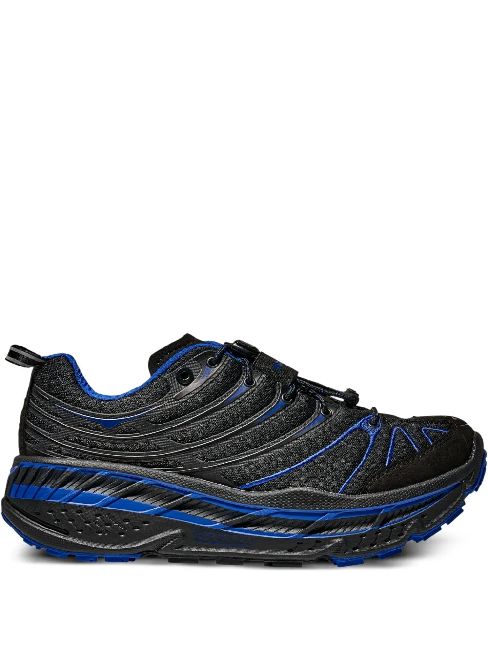 Black running sneakers with blue piping and textured rubber outsole
