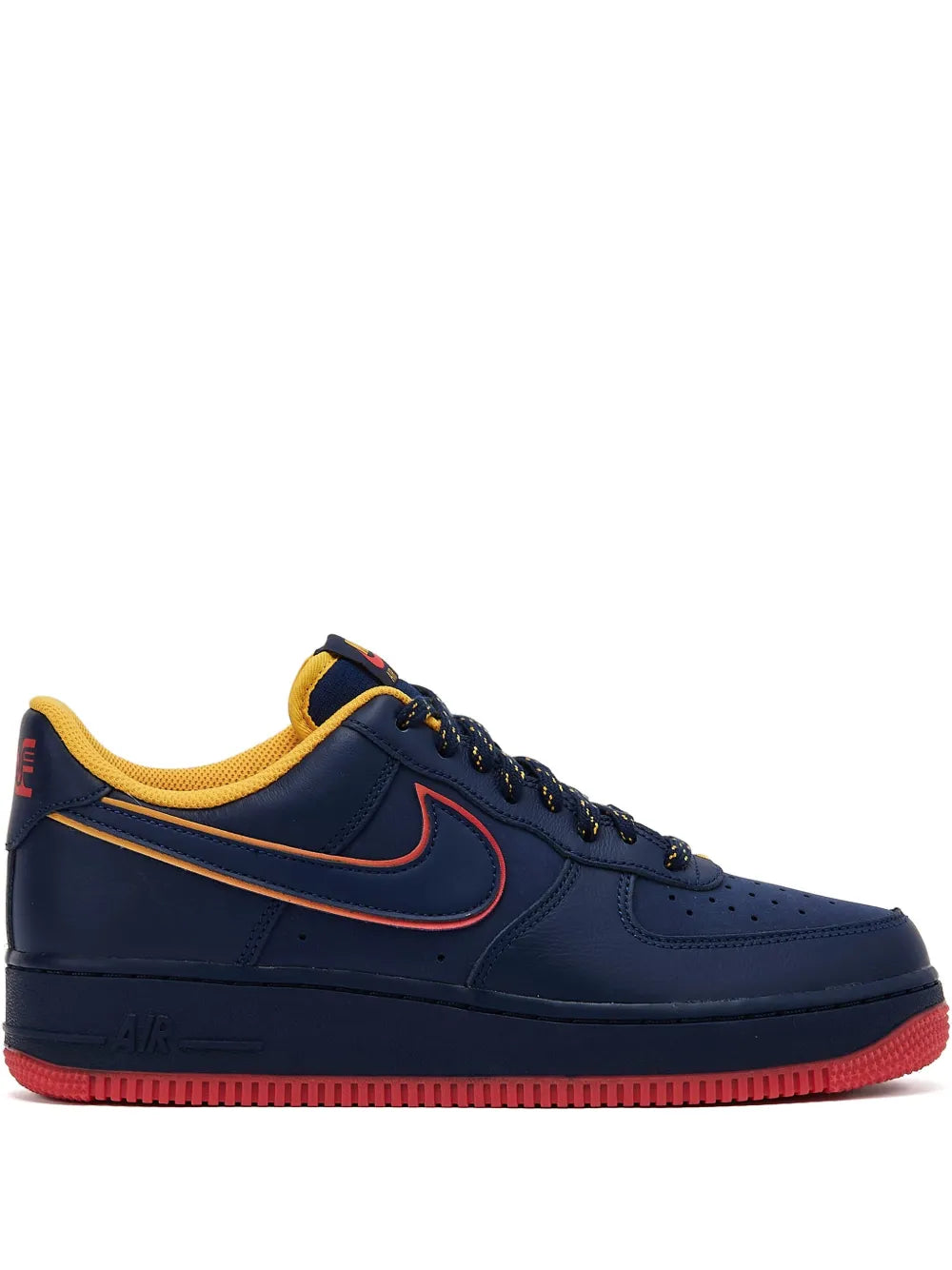 Navy low-top sneakers with red swoosh, yellow lining, and red rubber outsole