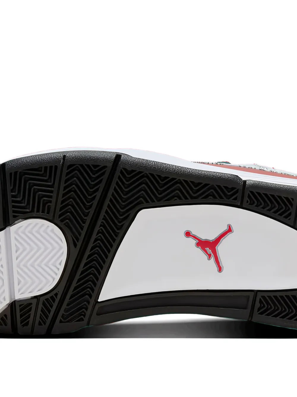 Rubber outsole with zigzag tread and red Jumpman logo on white panel