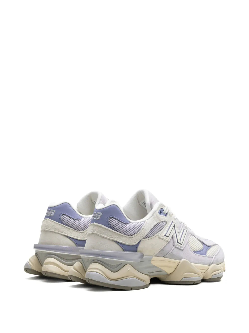 New Balance 9060 sneakers side view with blue heel overlay and beige sole