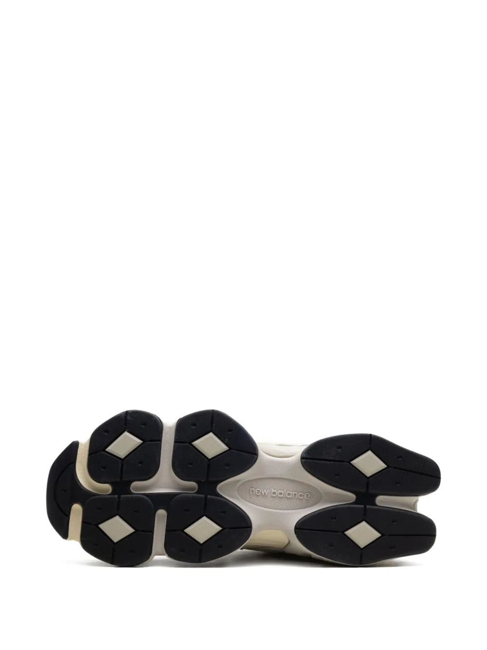 Sneaker outsole with multi-panel tread in dark rubber and beige midsole
