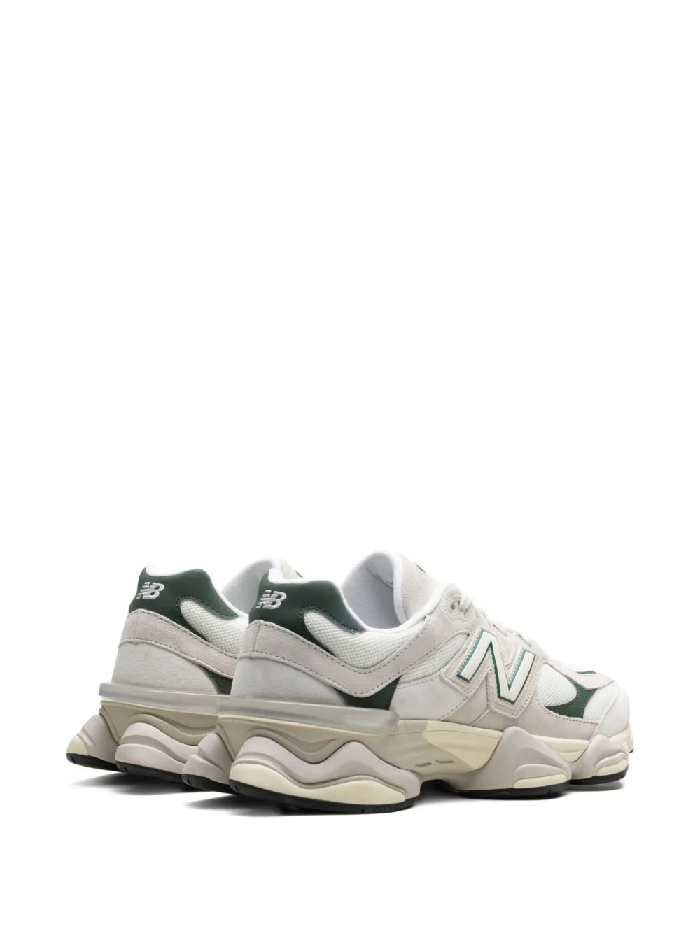 White chunky sneakers with green heel accents and New Balance N logo