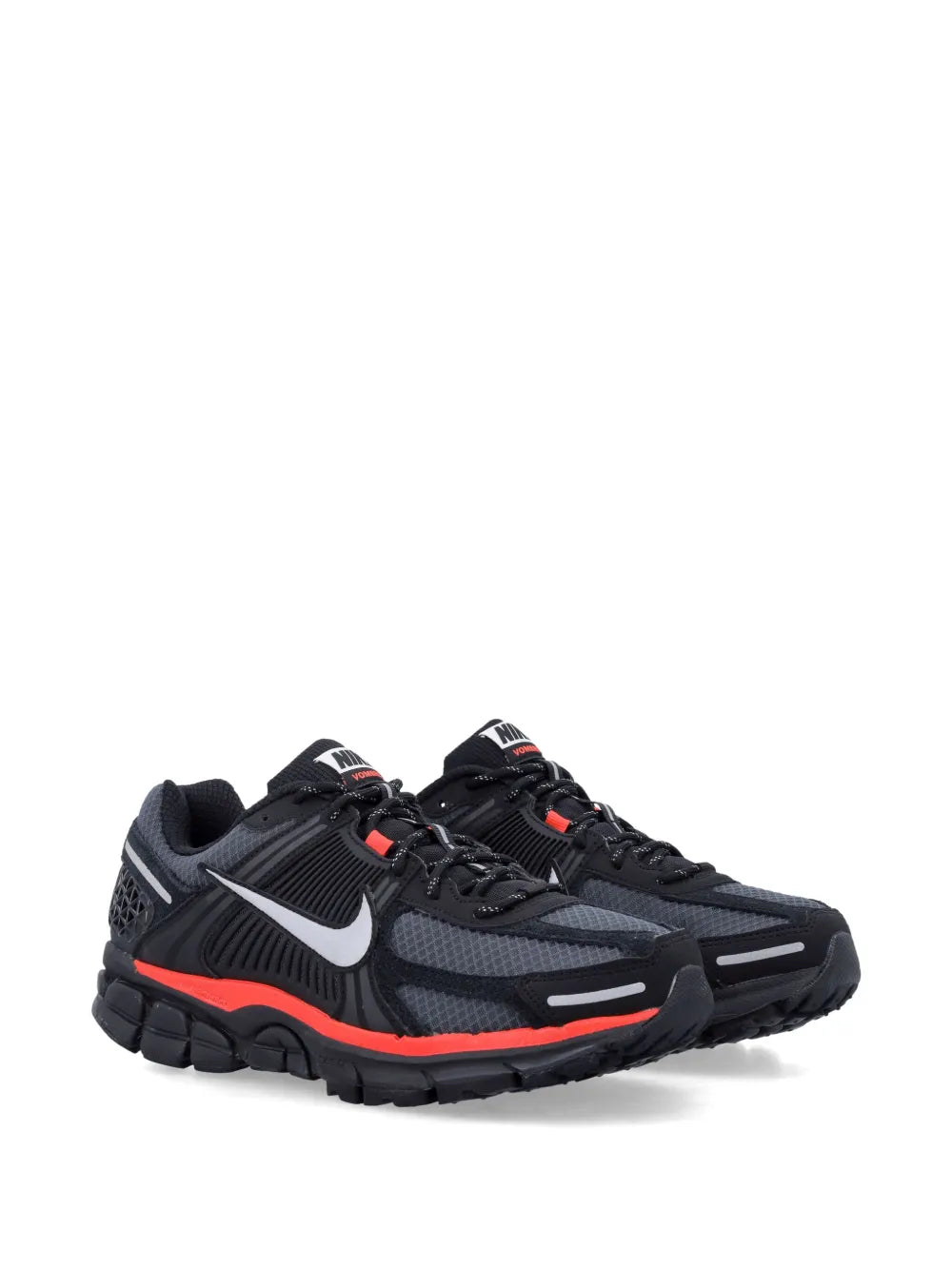 Nike running shoe in black with red trim, side view, cushioned chunky sole