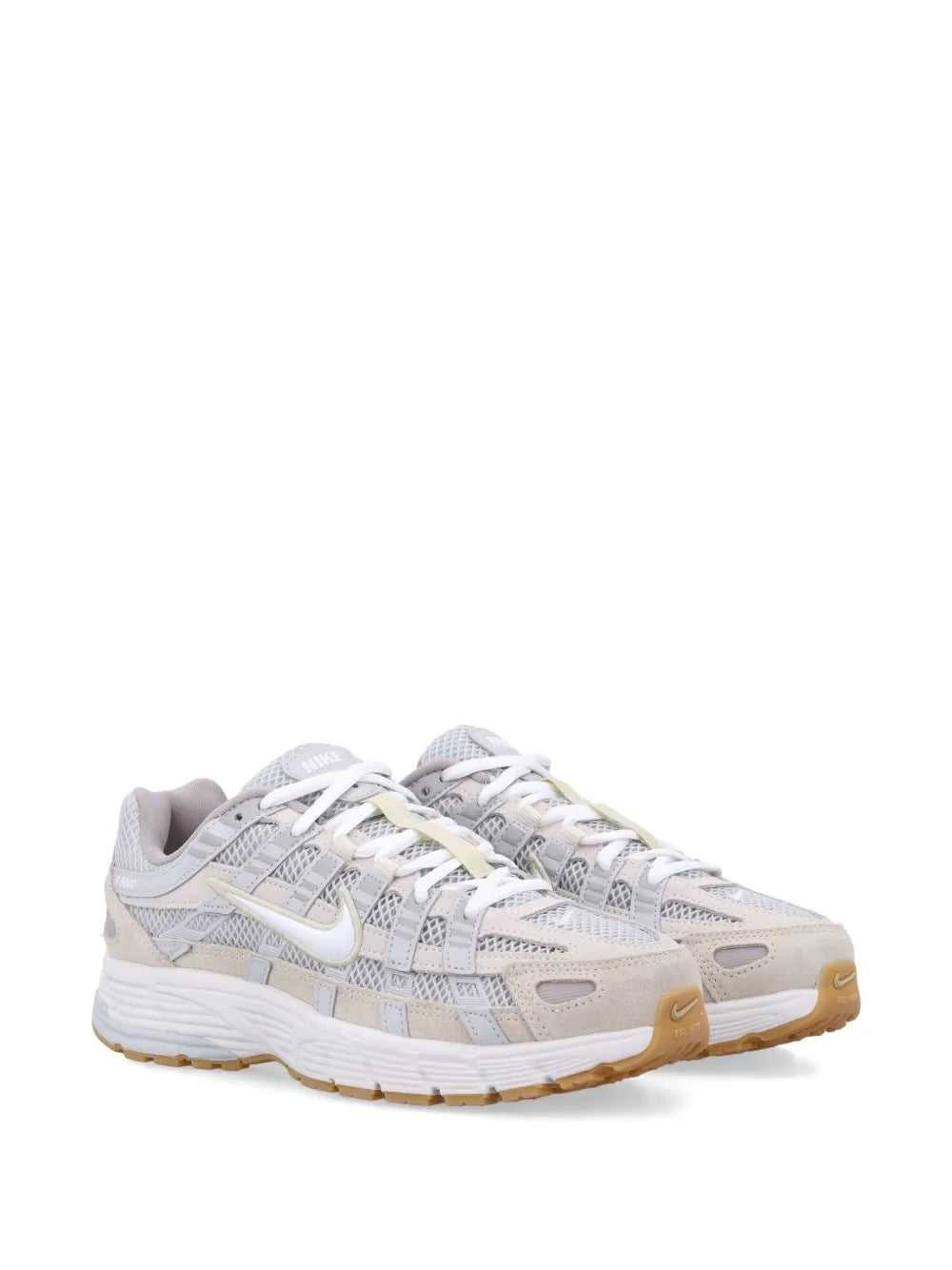 Running shoe in light grey with tan accents, lace-up, gum-style outsole