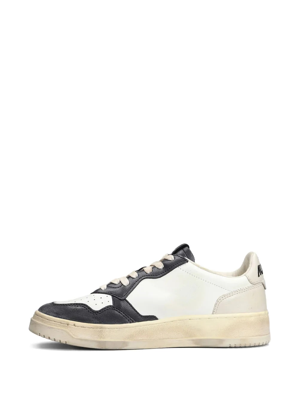 White leather and black panel low-top sneaker with lace-up and flat sole