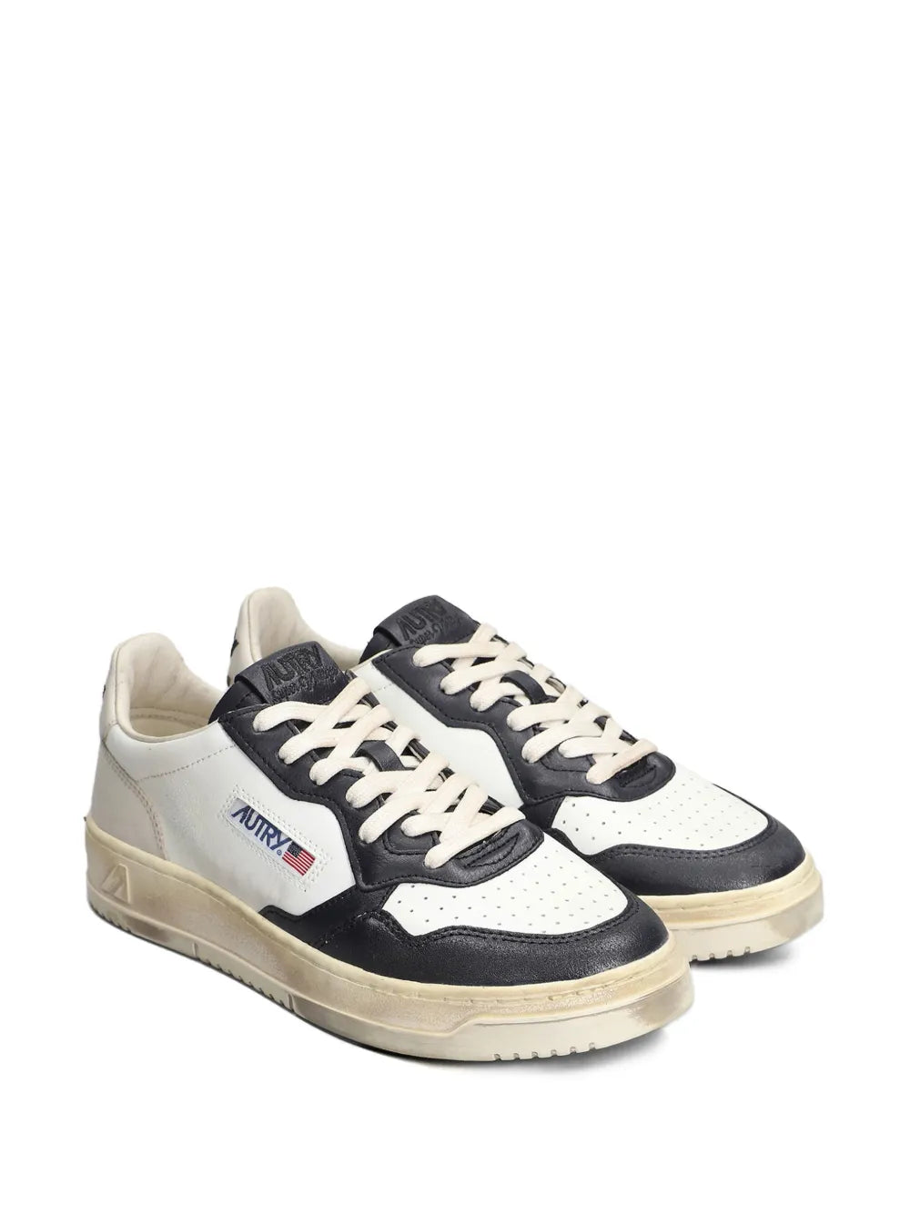 Black and white lace-up sneakers with vintage sole and side logo patch
