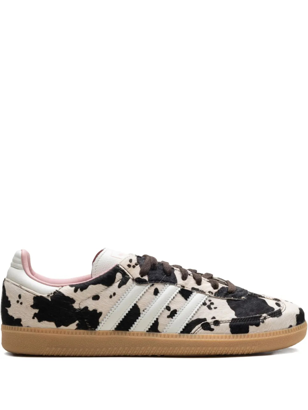 Brown-and-white low-top sneakers with black cow print, three stripes, gum sole