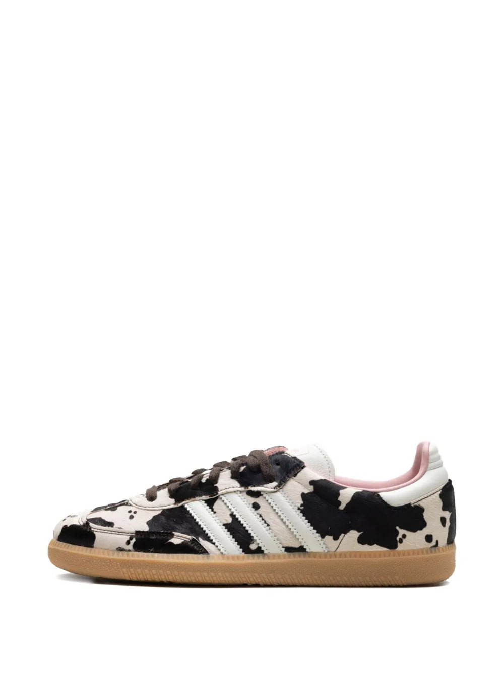 Side view low-top sneakers: white upper with black cow print, adidas stripes, laces