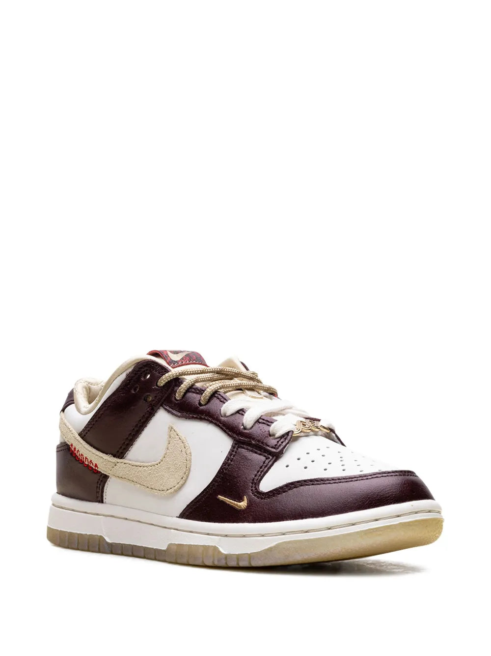 Nike Dunk Low Lx sneakers with white leather panels, dark brown overlays, tan swoosh