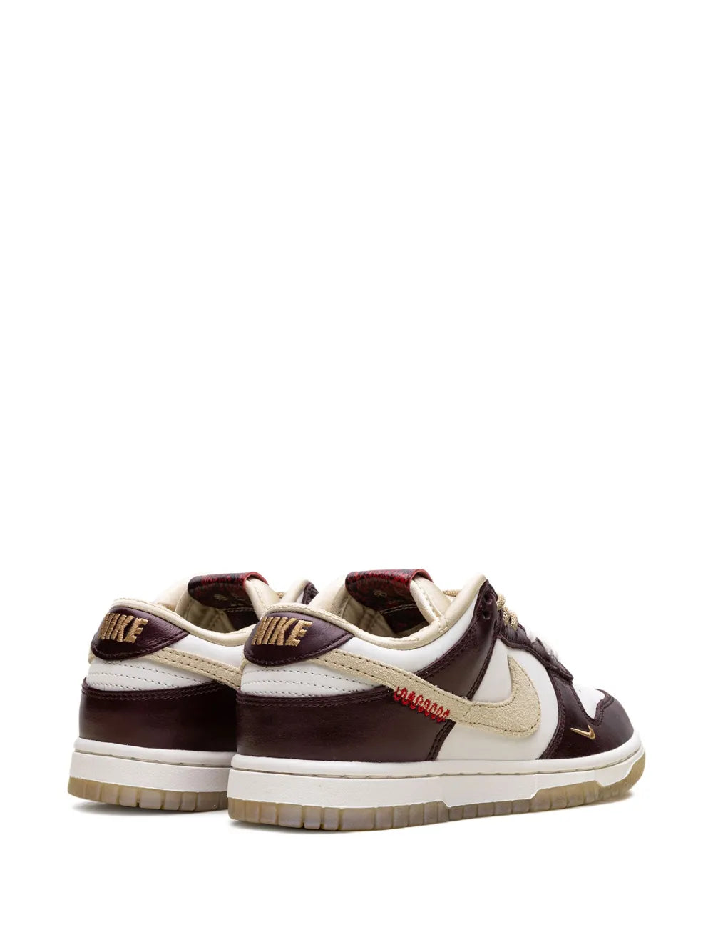 Nike Dunk Low Lx sneakers with heel tabs, dark brown and white uppers, tan laces