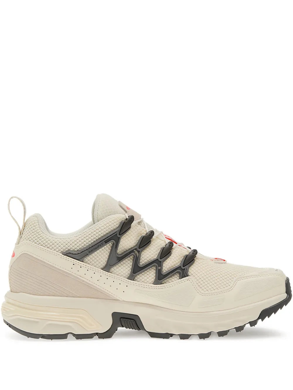Beige Salomon ACS trail running shoes with black panels and chunky rubber sole