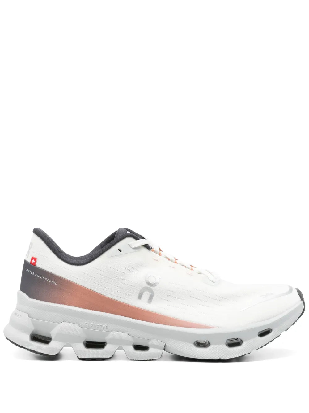 White running shoe with orange stripe, lace-up front, cushioned cloud sole