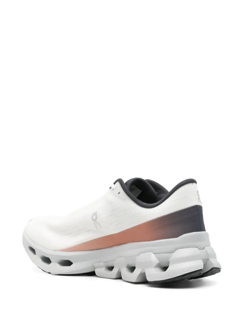White running shoe side view, orange accent panel, chunky cloud tread sole