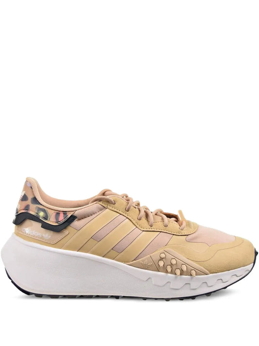Beige adidas Choigo running shoe, lace-up with three stripe overlays and white sole