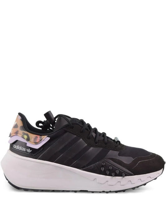 Black adidas lace-up sneaker with striped side panels and chunky white midsole