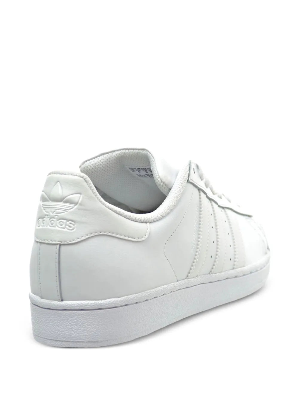 White leather low-top sneakers with adidas heel logo and cushioned collar
