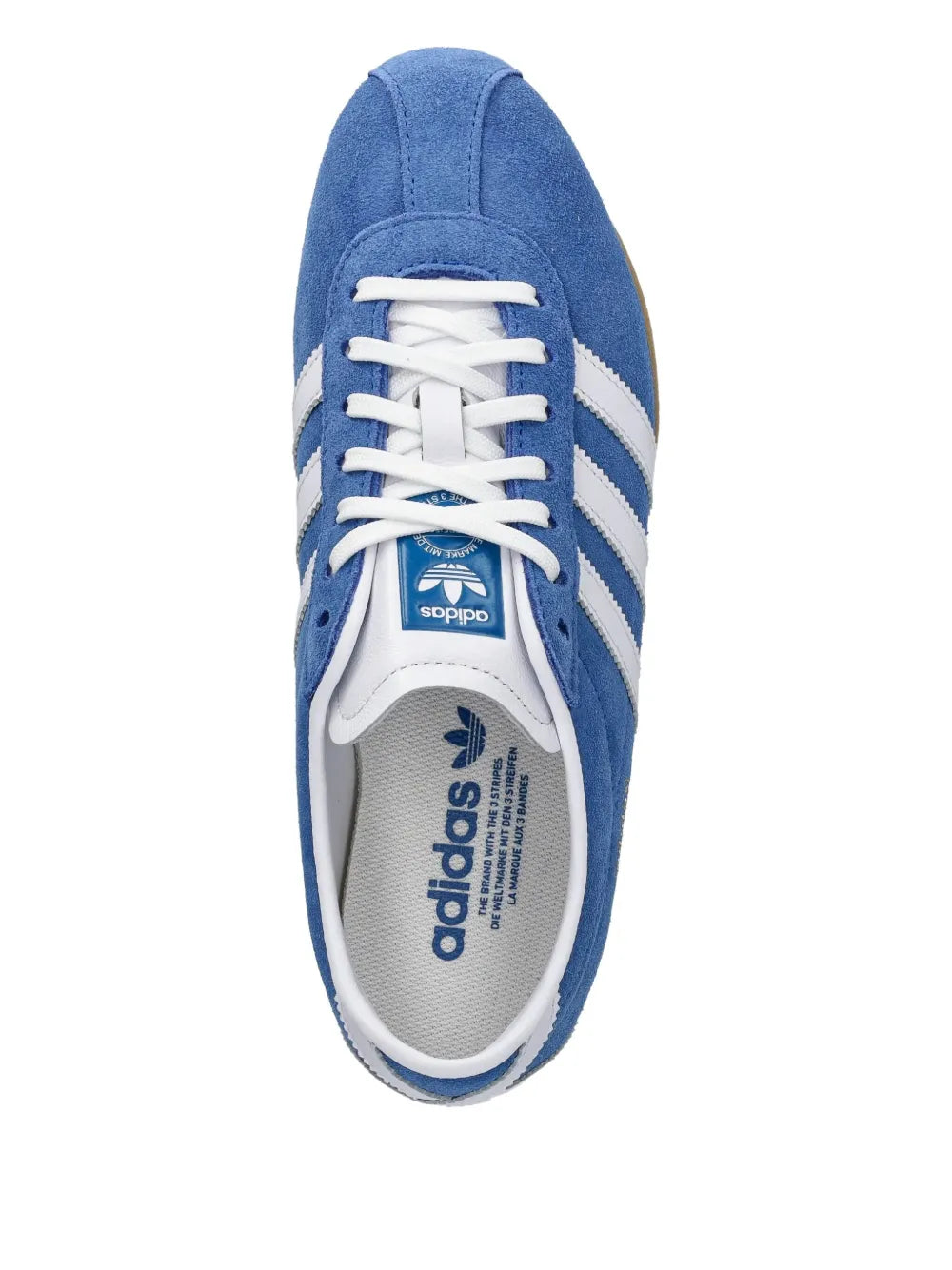 Blue adidas Tokyo sneakers with white laces, side stripes, and cushioned interior