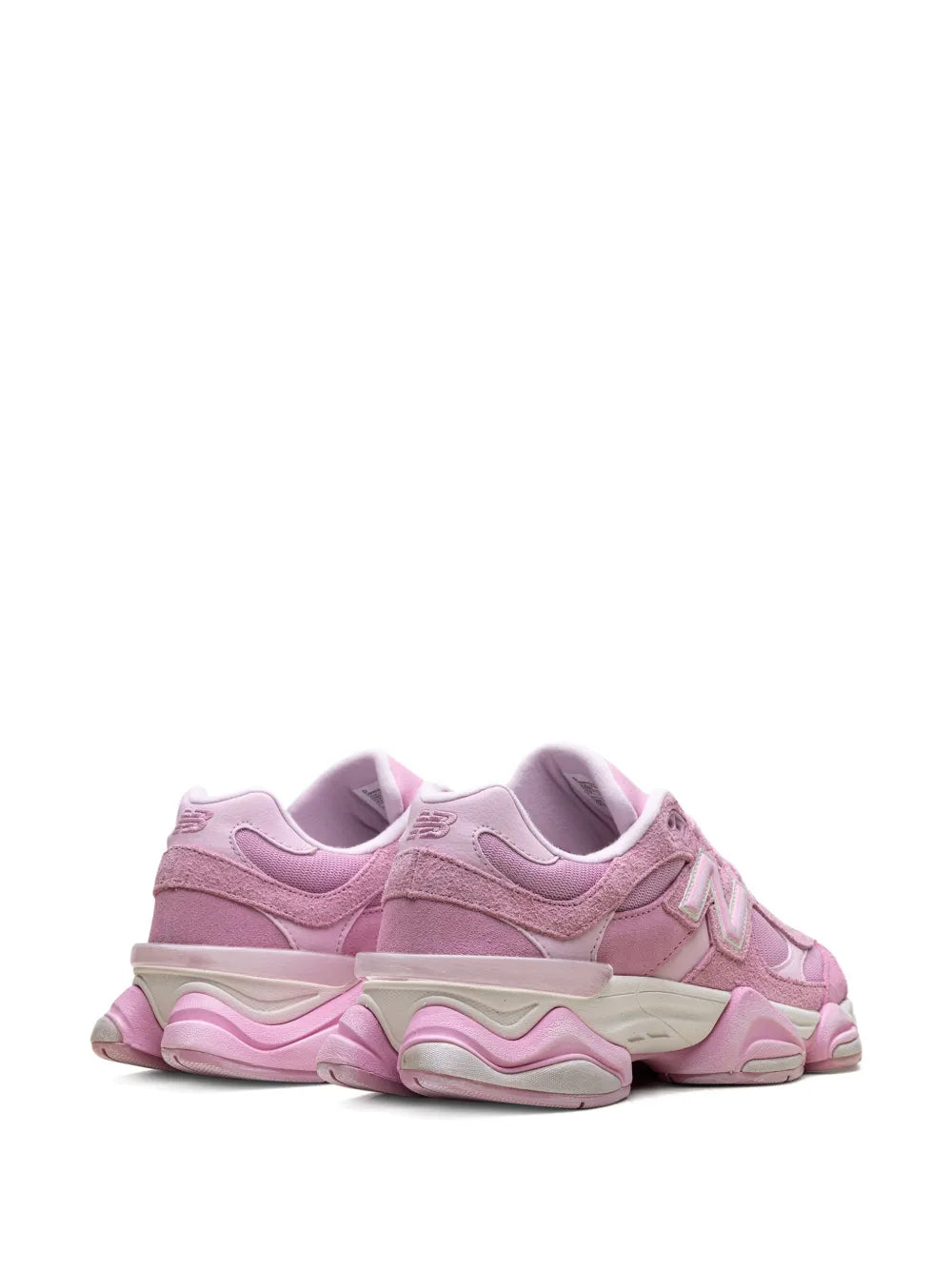 Light pink New Balance 9060 sneakers, rear quarter view with cushioned heel