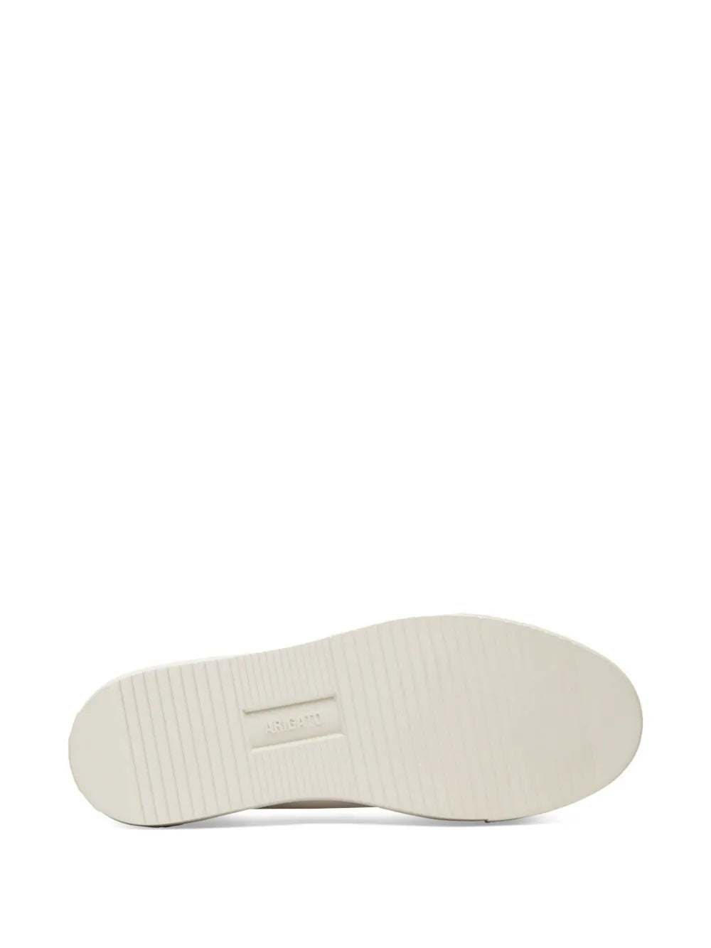 White sneaker outsole with textured tread and brand stamp