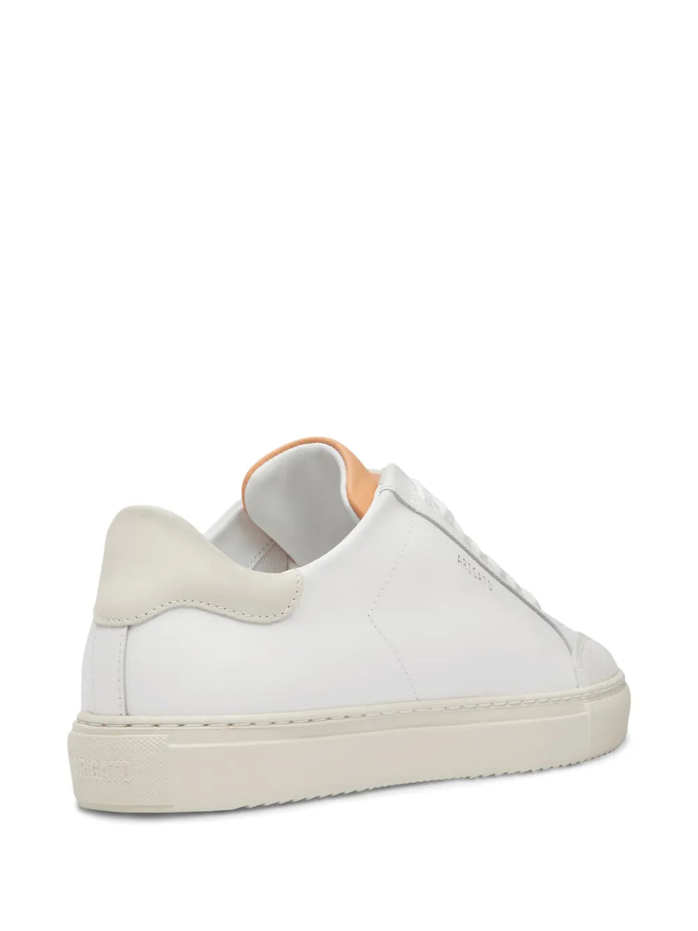 White low-top sneakers with padded collar and beige outsole