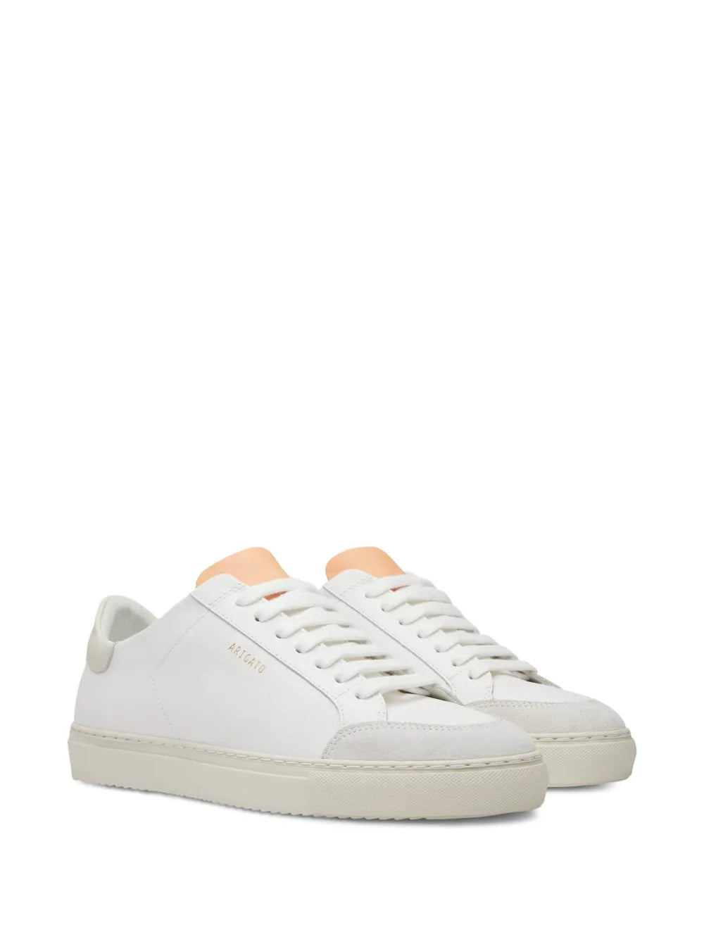 Pair of white lace-up low-top sneakers with beige outsole