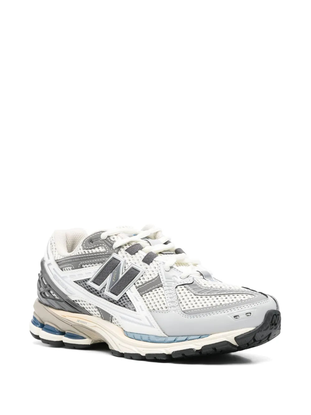 White and grey lace-up running sneakers, side view with N logo and blue outsole accents