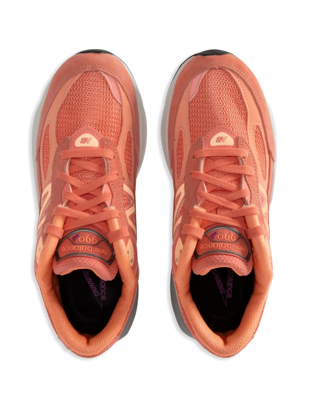 Peach orange New Balance 990V6 sneakers with black interior lining and lace-up tongues