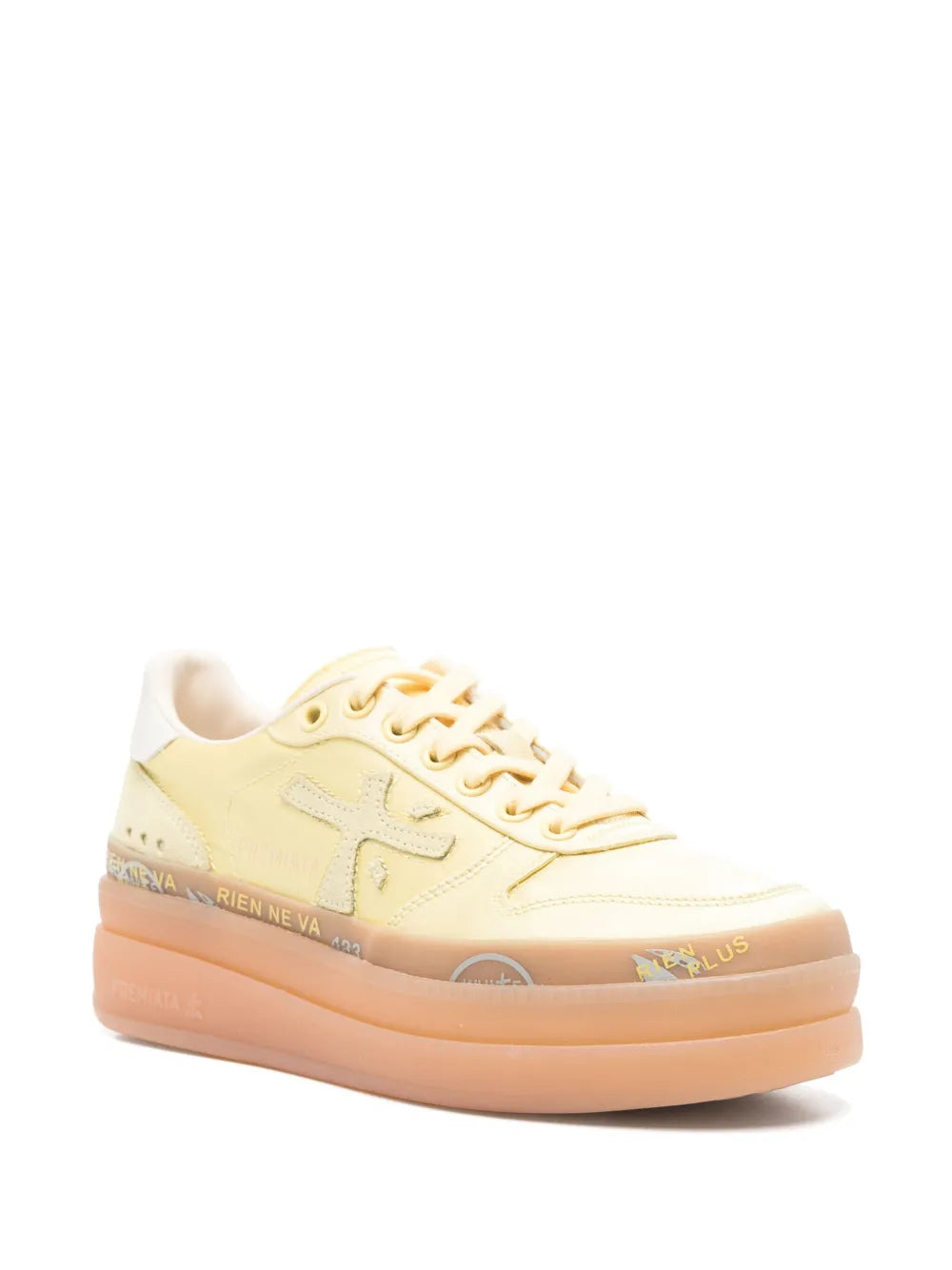 Pale yellow low-top lace-up sneakers with orange rubber platform sole
