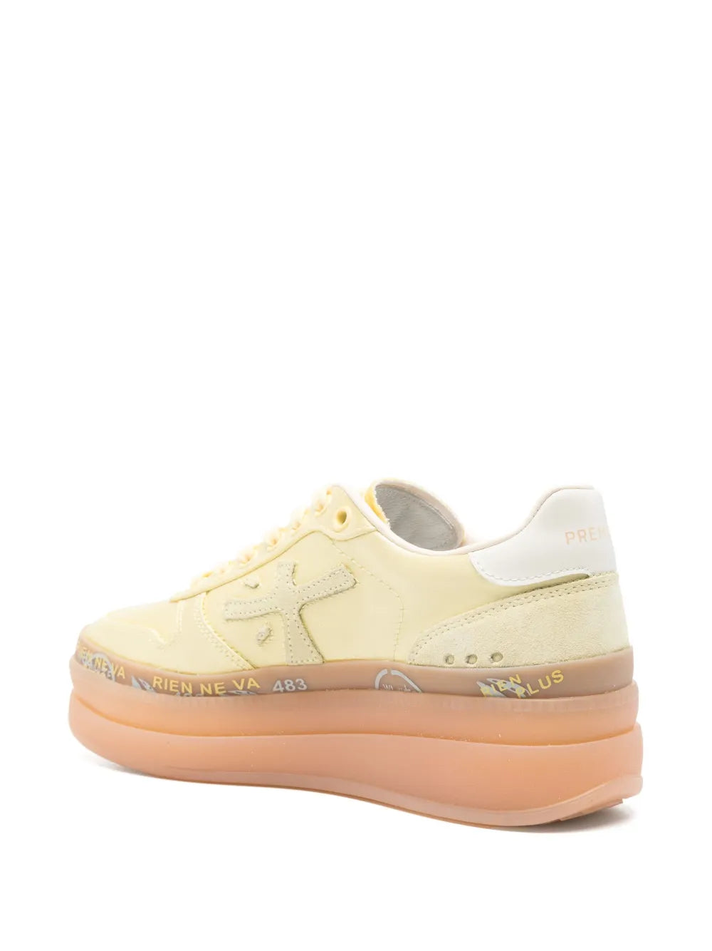 Pale yellow lace-up sneakers with orange platform sole, heel and side view